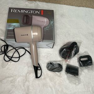 Remington Pro Wet 2 Style hair dryer. Comes with 4 unique attachments.
